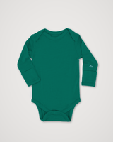 A long-sleeve baby bodysuit in a solid dark teal green color, laid flat on a light gray background. A small white embroidered logo is visible on the left sleeve cuff. #color_evergreen