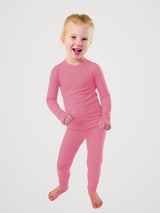 Iksplor kids pink merino wool long sleeve top and matching leggings set on a smiling child  #color_alpenglow