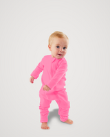 Toddler walking barefoot while wearing a bright pink Merino Wool Adventure Zippy romper with front zipper #color_alpenglow