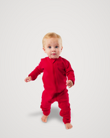 Toddler walking barefoot while wearing a red Merino Wool Adventure Zippy romper with front zipper #color_campfire