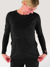 Iksplor black merino wool long sleeve nursing top with thumb holes on a woman against a white background #color_teton eclipse - black