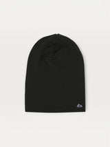 Iksplor black merino wool beanie for kids with a small white mountain logo on a light background