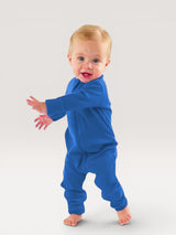 Iksplor baby wearing a vibrant blue merino wool zip romper with long sleeves and snug cuffs for all-season comfort. #color_ocean