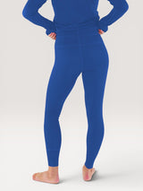 Iksplor royal blue midweight merino wool leggings worn by a person, back view showing a fitted, comfortable design. #color_ocean