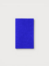 Iksplor royal blue merino wool iron-on patch for repairing sweaters and knit garments on a neutral background #color_ocean