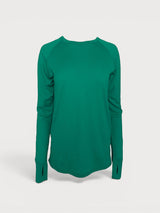 Iksplor emerald green merino wool long sleeve top with thumbhole cuffs and a curved hemline. #color_evergreen