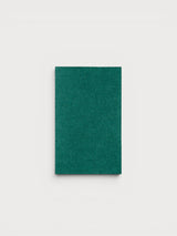 Iksplor emerald green merino wool iron-on patch for repairing sweaters and knitwear garments. #color_evergreen