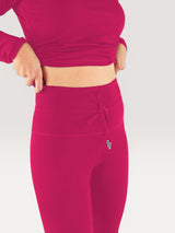 Iksplor fuchsia merino wool midweight leggings with a high-waisted drawstring design worn by a woman. #color_peak pink