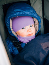 Iksplor merino wool neck gaiter in purple worn by a baby in a blue hooded winter jacket #color_lilac