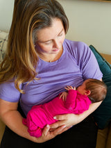 Iksplor purple merino wool short sleeve nursing t-shirt worn by a mother breastfeeding her newborn baby #color_lilac
