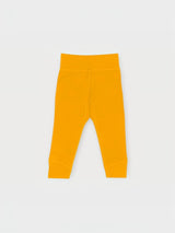 Iksplor baby leggings in mustard yellow merino wool with a comfortable wide waistband for a secure fit. #color_yellowstone
