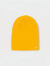 Iksplor mustard yellow merino wool beanie for kids with a small white mountain logo on the bottom corner.  #color_yellowstone