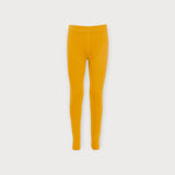 Iksplor kids mustard yellow merino wool base layer leggings with a soft, breathable, and temperature-regulating fit. #color_yellowstone