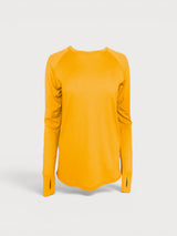 Iksplor mustard yellow merino wool long sleeve top with thumbhole cuffs and a curved hem. #color_yellowstone