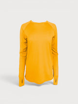 Iksplor mustard yellow merino wool long sleeve top with thumbhole cuffs and a curved hem. #color_yellowstone