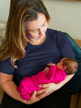 Iksplor navy blue merino wool short sleeve nursing t-shirt worn by a mother breastfeeding her baby. #color_starry night