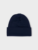 Iksplor navy blue merino wool beanie for kids, soft and breathable slim-fit hat for all-season wear. #color_starry night