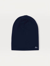 Iksplor navy blue merino wool beanie for kids with a small white mountain logo on the bottom corner. #color_starry night