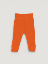 Iksplor baby merino wool leggings in bright orange with a comfortable wide waistband for a secure fit. #color_poppy
