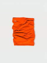Iksplor bright orange merino wool neck gaiter with a small white mountain logo on a light grey background. #color_poppy