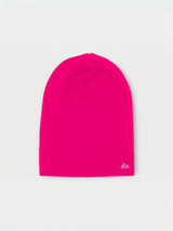 Iksplor bright pink merino wool beanie for kids with a small white mountain logo on the bottom edge. #color_peak pink