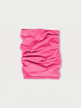 Iksplor bright pink merino wool neck gaiter with a small white mountain logo on a light grey background. #color_alpenglow