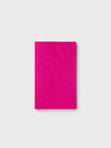 Iksplor bright pink merino wool iron-on repair patch for sweaters and knitwear on a neutral background #peak_pink