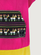 Iksplor x SURreal pink terry cloth towel poncho with a black patterned front pocket and co-branded woven label. #color_wild fuchsia