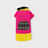 Iksplor x SURreal pink and yellow hooded towel poncho with a patterned front pocket and soft terry cloth fabric. #color_wild fuschia