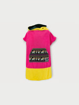 Iksplor x SURreal pink and yellow hooded towel poncho with a patterned front pocket and soft terry cloth fabric. #color_wild fuschia