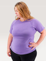 Iksplor purple short sleeve merino wool nursing t-shirt worn by a woman against a neutral background #color_lilac