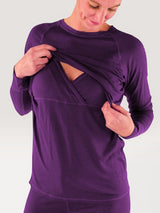 Iksplor purple merino wool long sleeve nursing top with discreet access and thumb holes worn by a woman #color_huck-it-berry