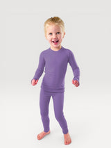 Iksplor kids purple merino wool base layer leggings and long sleeve top set worn by a happy child #color_lilac