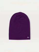 Iksplor purple merino wool beanie for kids with a small white mountain logo on the hem