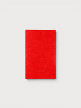 Iksplor rectangular red merino wool iron-on patch for repairing sweaters and knitwear garments. #color_wild flame